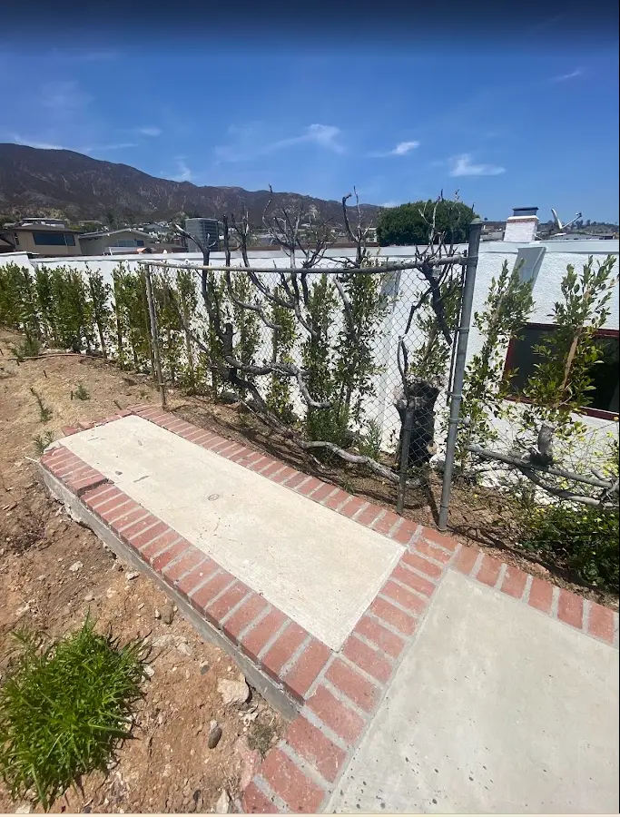 Completed broom-finish concrete sidewalk and accessible transition