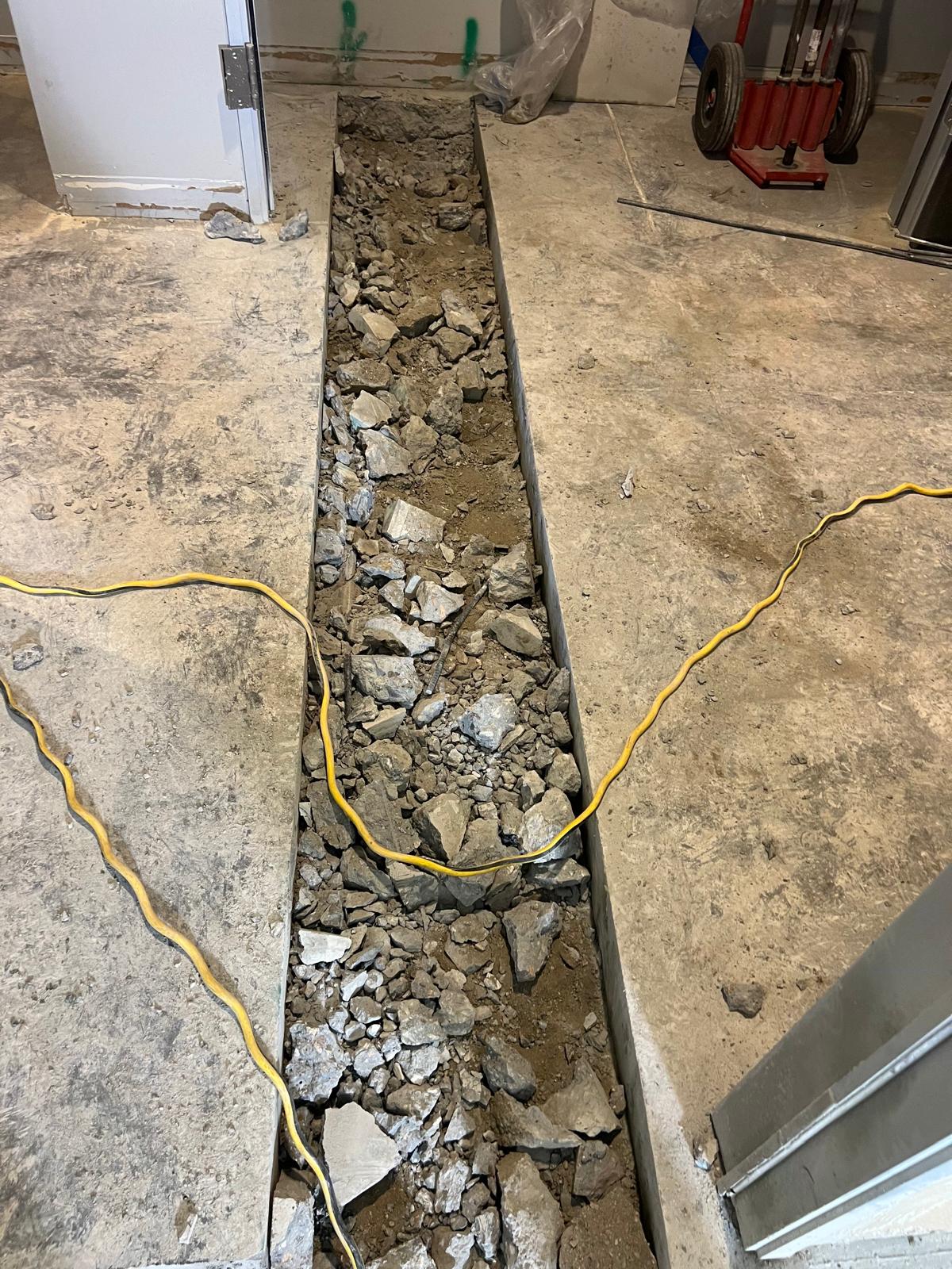 Concrete slab trench excavation during Pacific Palisades renovation